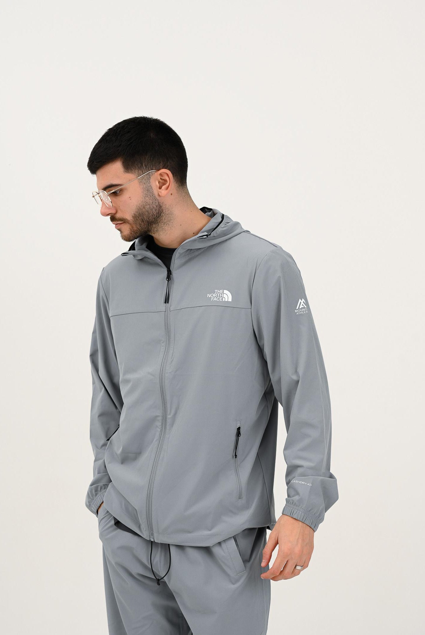 THE NORTH FACE Giacca a vento Mountain Athletics grigia da uomo NF0A8BP1H5F1 . THE NORTH FACE