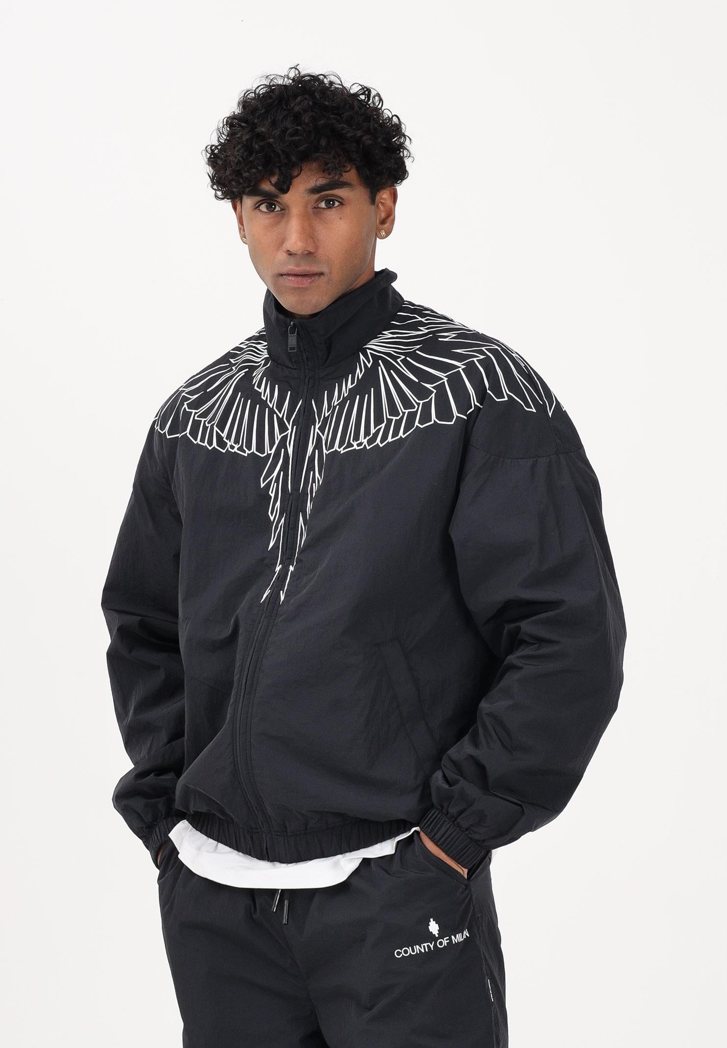 MARCELO BURLON COUNTY OF MILAN Giacca a vento nera da uomo con grafica ali S6CMMAJK075 110 MARCELO BURLON COUNTY OF MILAN