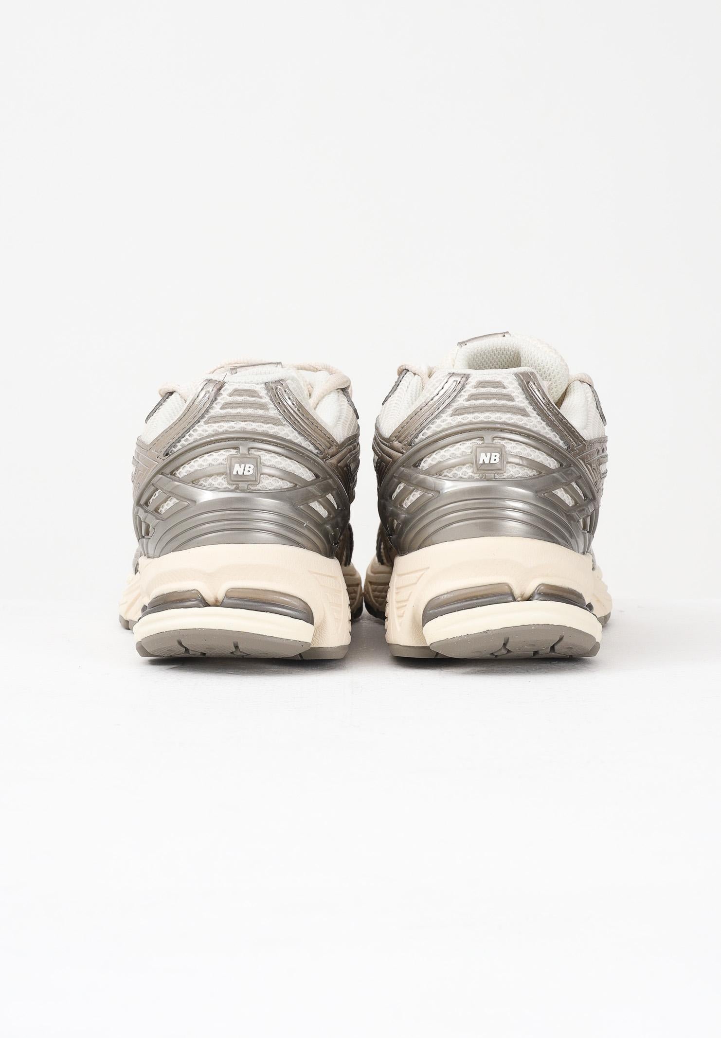 NEW BALANCE Sneakers 1906R panna e argento per uomo e donna U1906RCN . NEW BALANCE