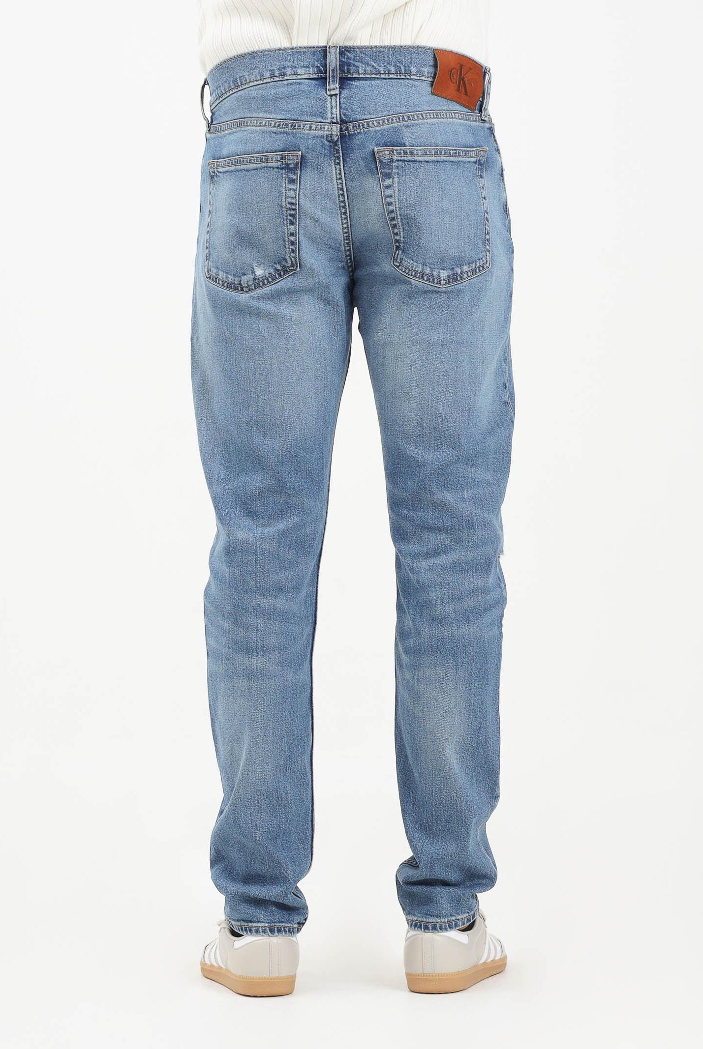 CALVIN KLEIN JEANS Jeans in denim blu chiaro con lavaggio delavé da uomo LV04LB780GRDC . CALVIN KLEIN JEANS