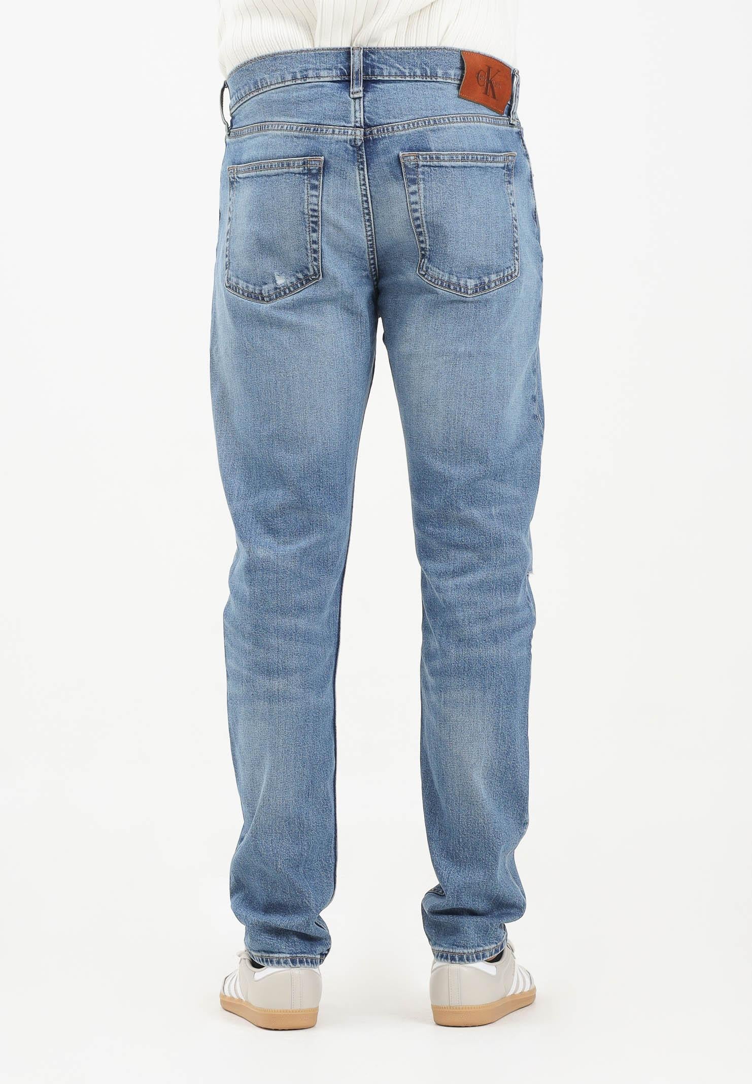CALVIN KLEIN JEANS Jeans in denim blu chiaro con lavaggio delavé da uomo LV04LB780GRDC . CALVIN KLEIN JEANS