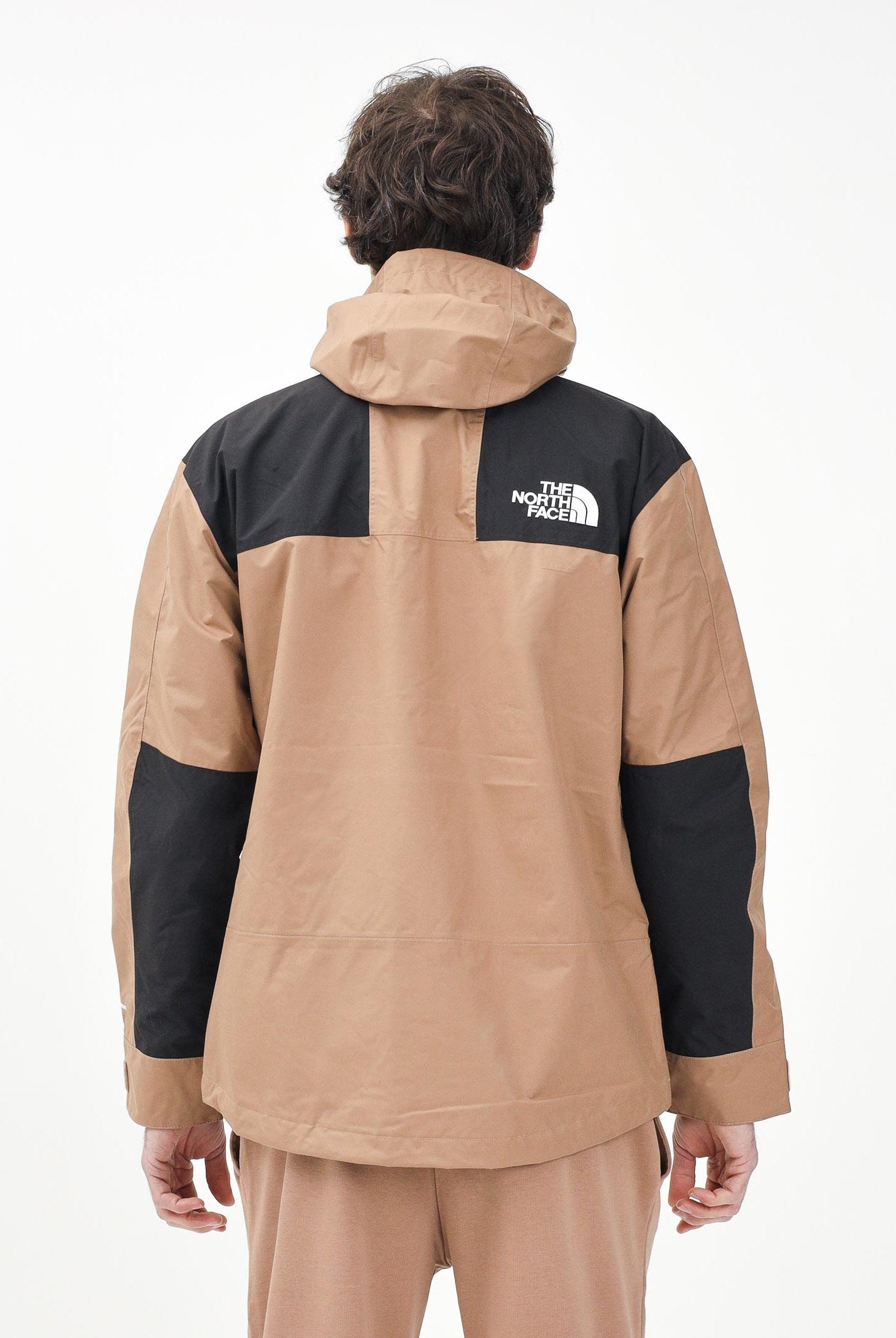 THE NORTH FACE Giacca a vento Reign On marrone e nera da uomo NF0A8B5G58W1 . THE NORTH FACE