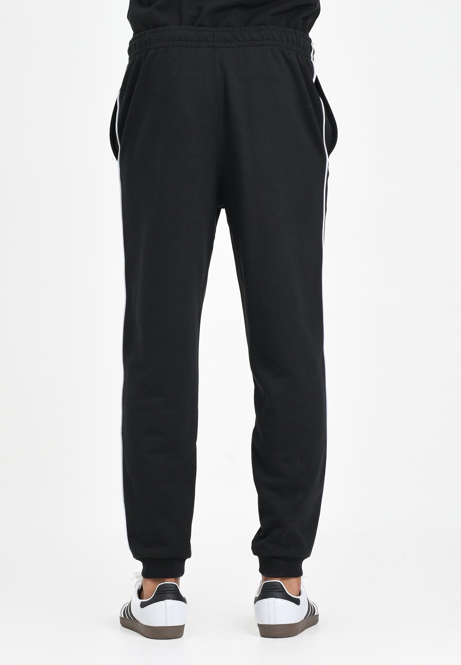 LACOSTE Pantalone sportivo nero per uomo e donna con riga logata XH9803 031 LACOSTE