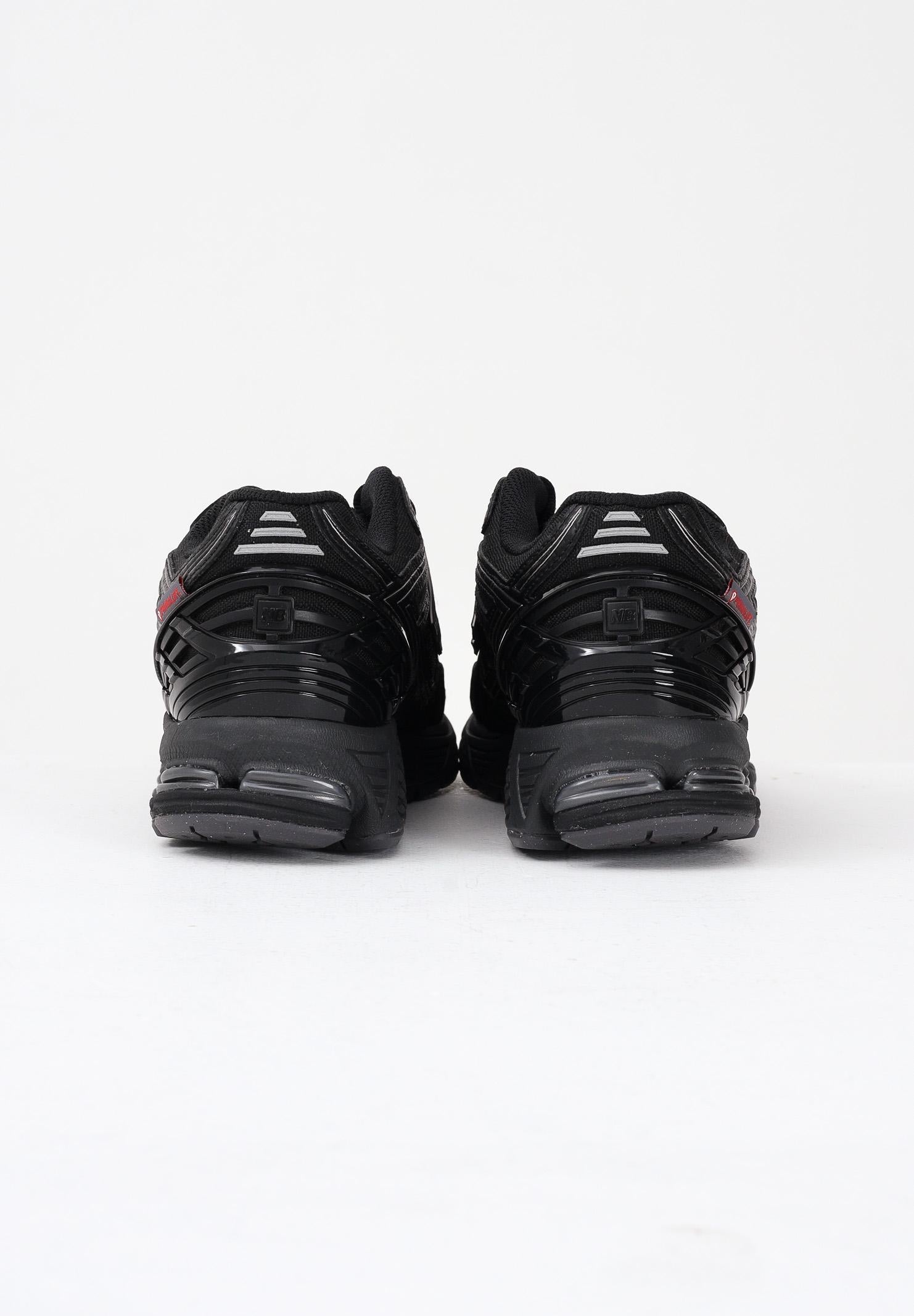 NEW BALANCE Sneakers 1906R nere per uomo e donna U1906ROE . NEW BALANCE