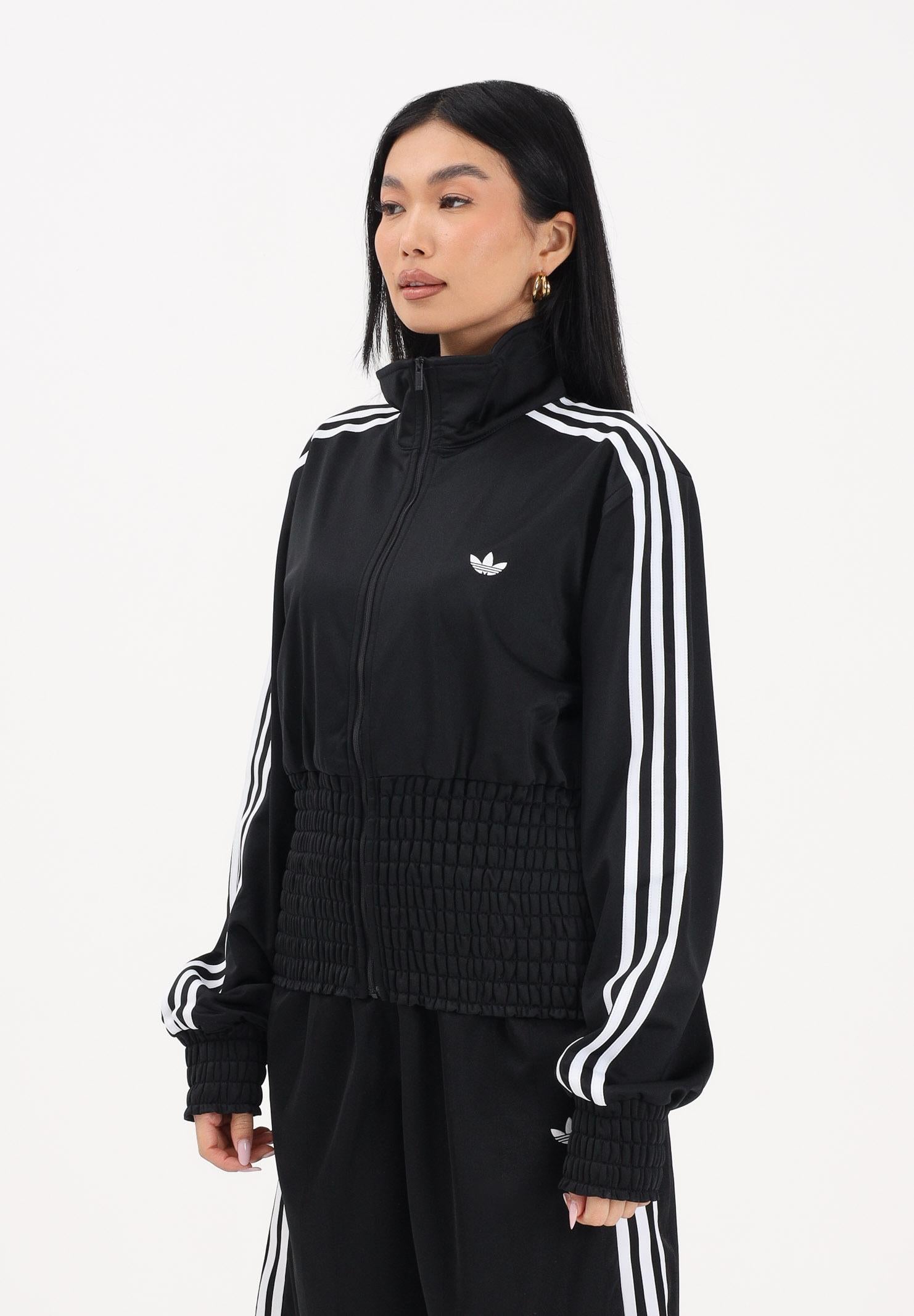 ADIDAS ORIGINALS Felpa con zip Smocked Firebird nera da donna KD0303 . ADIDAS ORIGINALS
