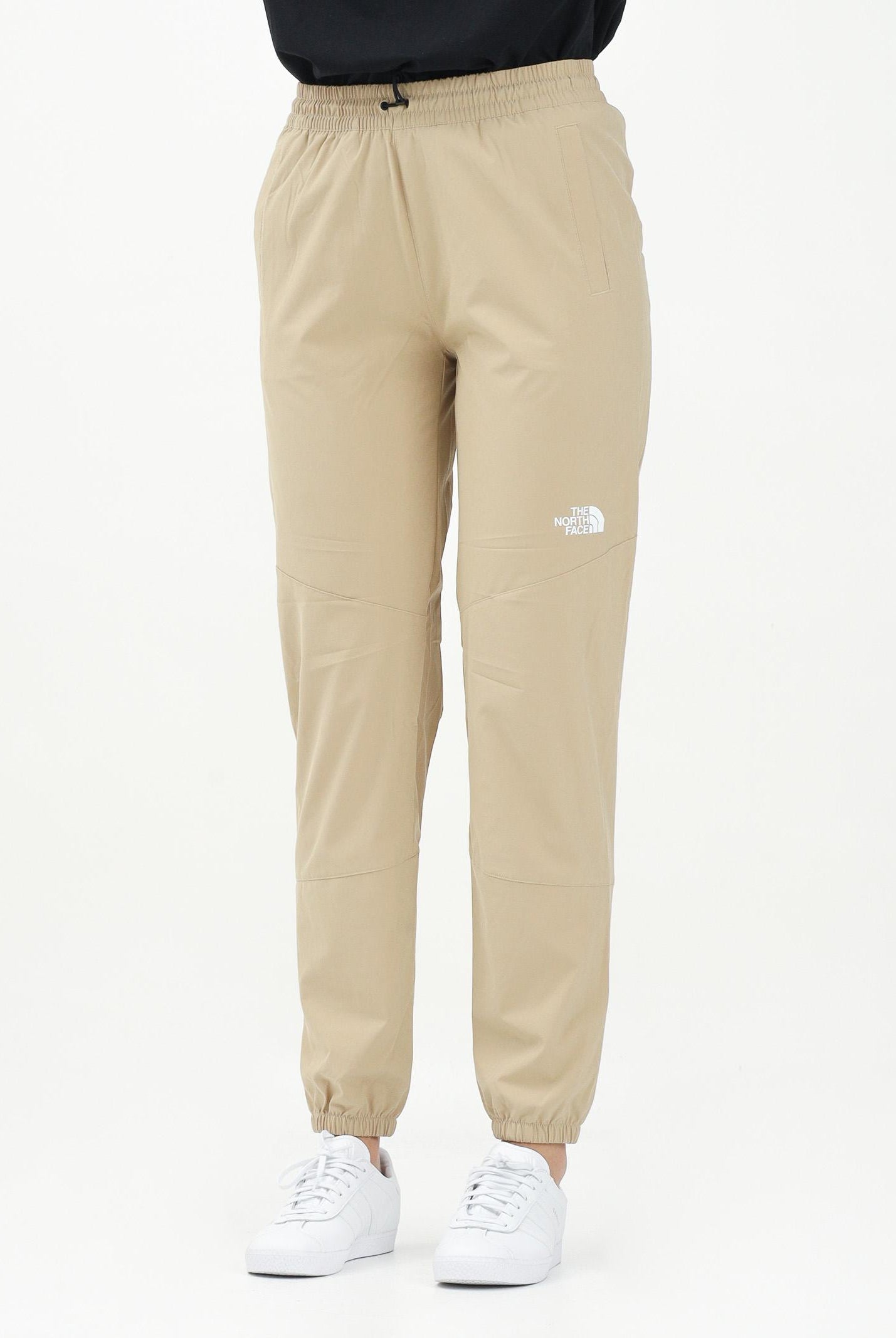 THE NORTH FACE Pantalone antivento Mountain Athletics beige da donna NF0A8BGPLK51 . THE NORTH FACE