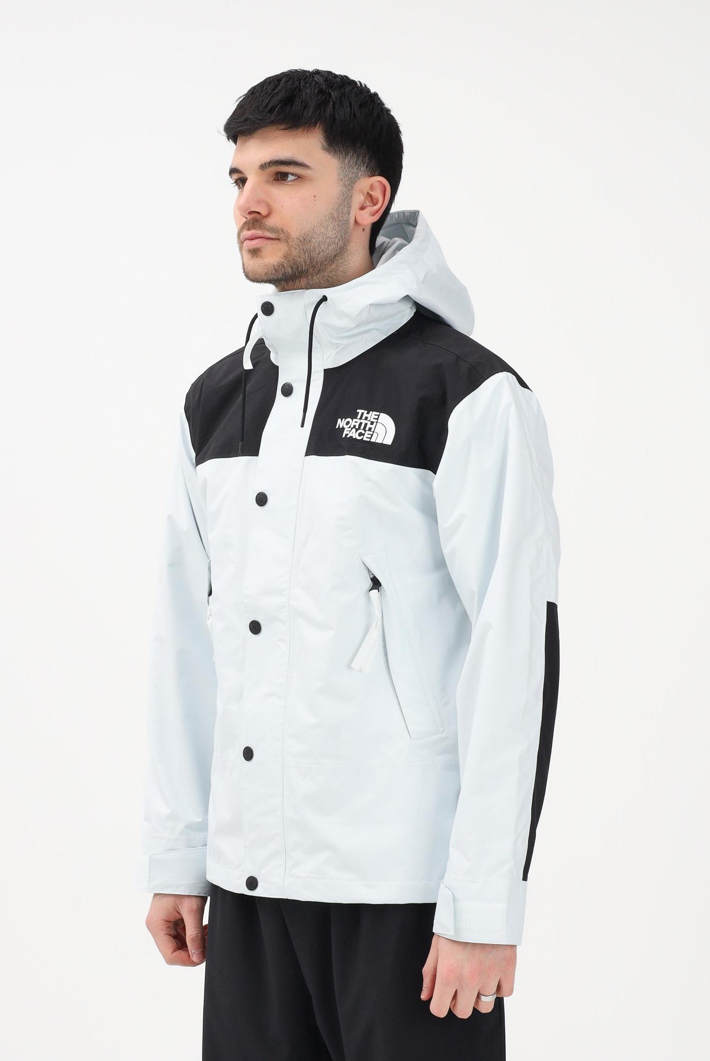 THE NORTH FACE Giacca a vento Reign On celeste e nera da uomo NF0A8B5GJL61 . THE NORTH FACE