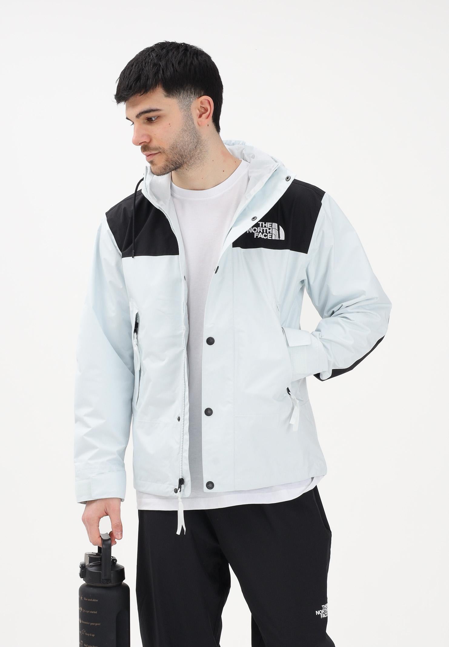 THE NORTH FACE Giacca a vento Reign On celeste e nera da uomo NF0A8B5GJL61 . THE NORTH FACE
