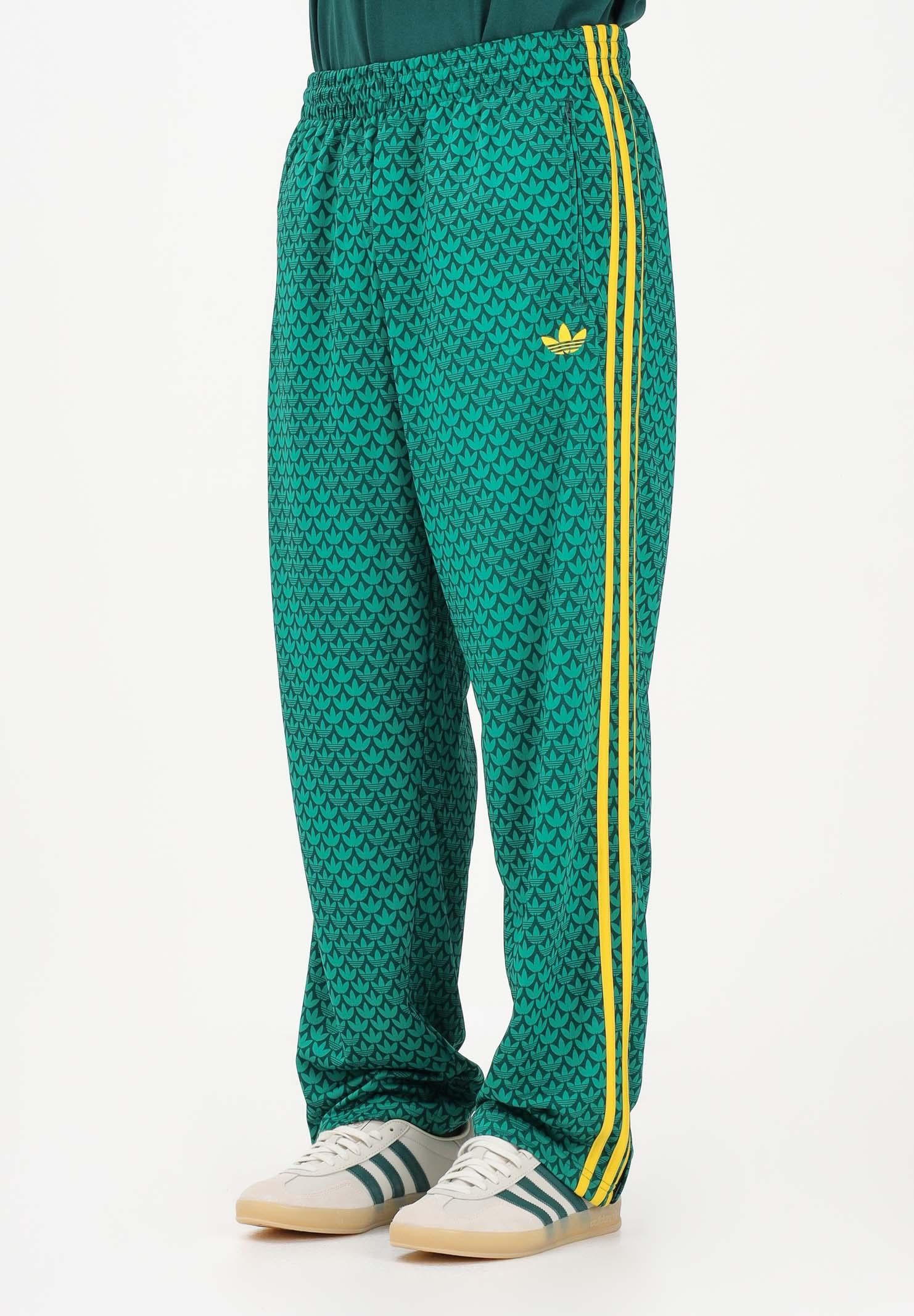 ADIDAS ORIGINALS Pantalone sportivo FIREBIRD LOOSE MONOGRAM verde e giallo da uomo KD0396 . ADIDAS ORIGINALS