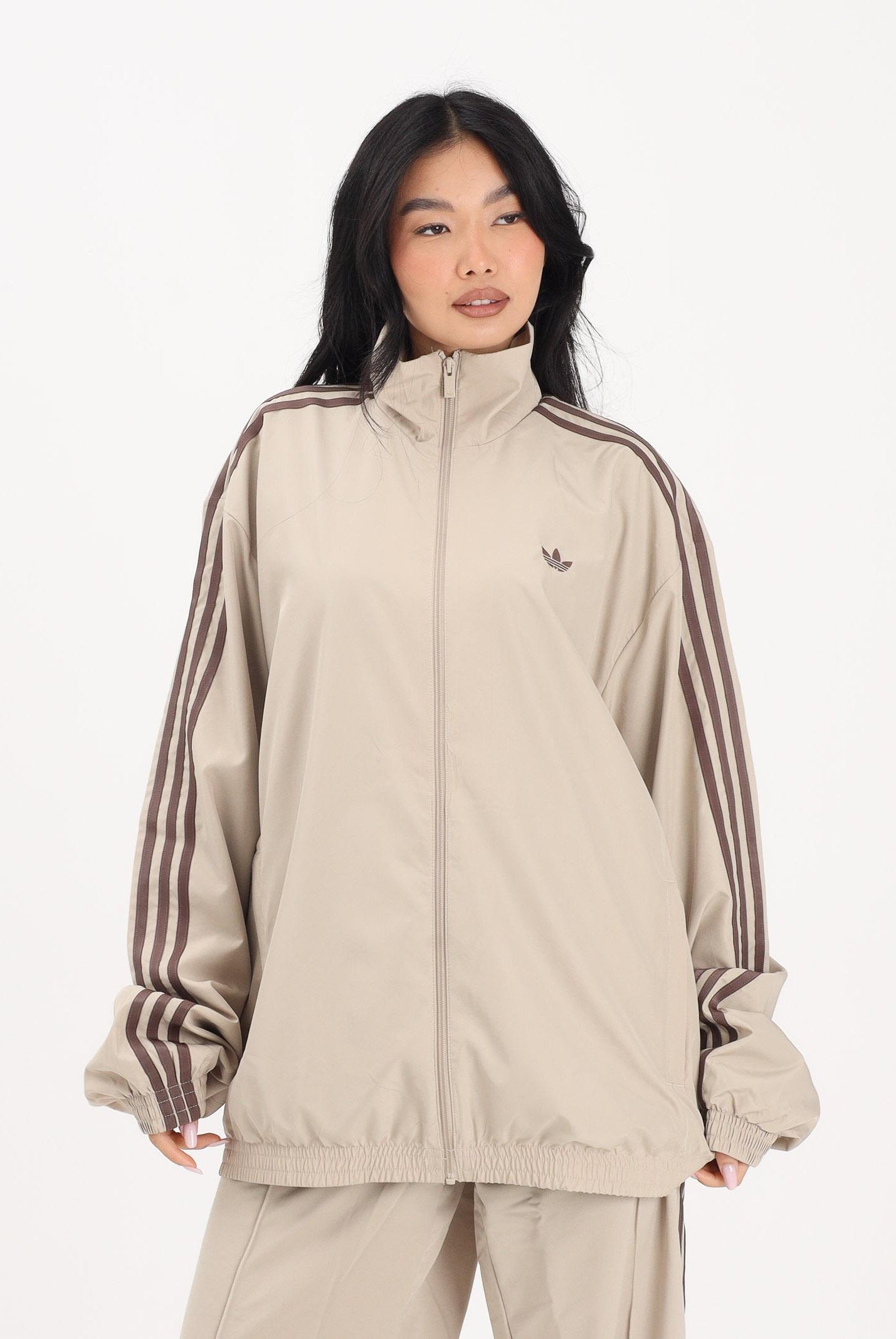ADIDAS ORIGINALS Giacca a vento Firebird Adilenium beige da donna KD6297 . ADIDAS ORIGINALS