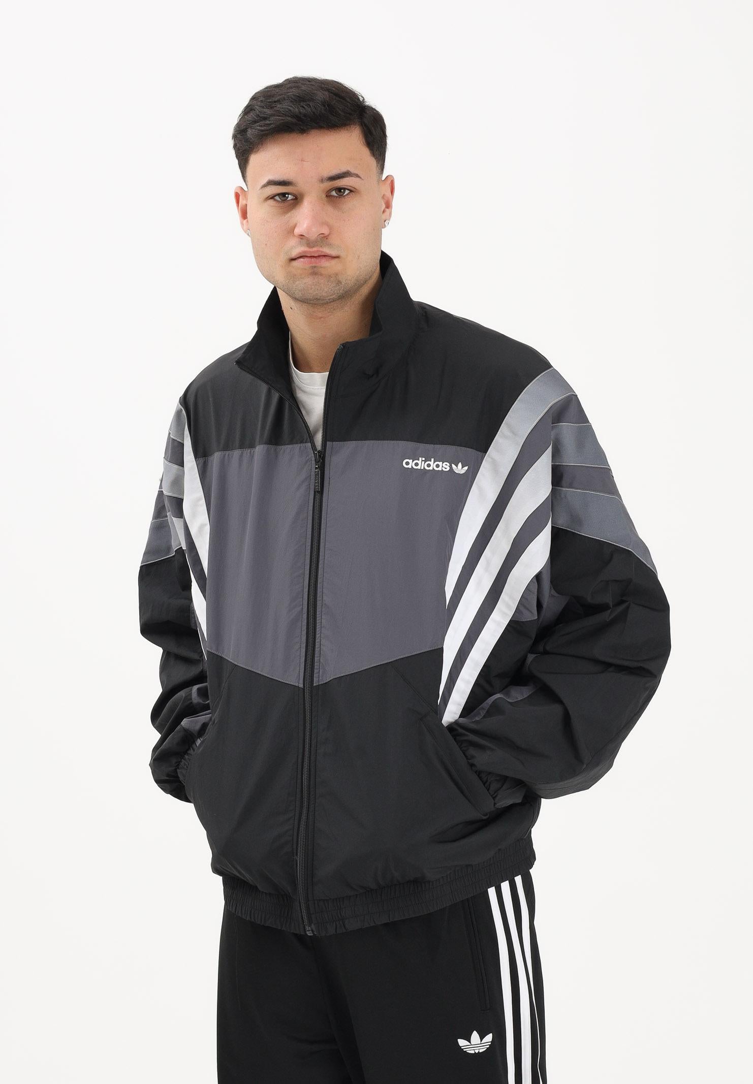 ADIDAS ORIGINALS Giacca a vento SANTIAGO nera e grigia da uomo KS8326 . ADIDAS ORIGINALS