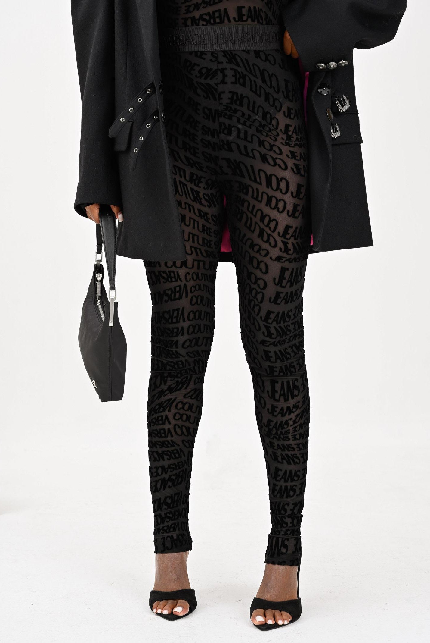 VERSACE JEANS COUTURE Leggings nero da donna con motivo Liquify Logomania vellutato 79HAC101JS490 899 VERSACE JEANS COUTURE