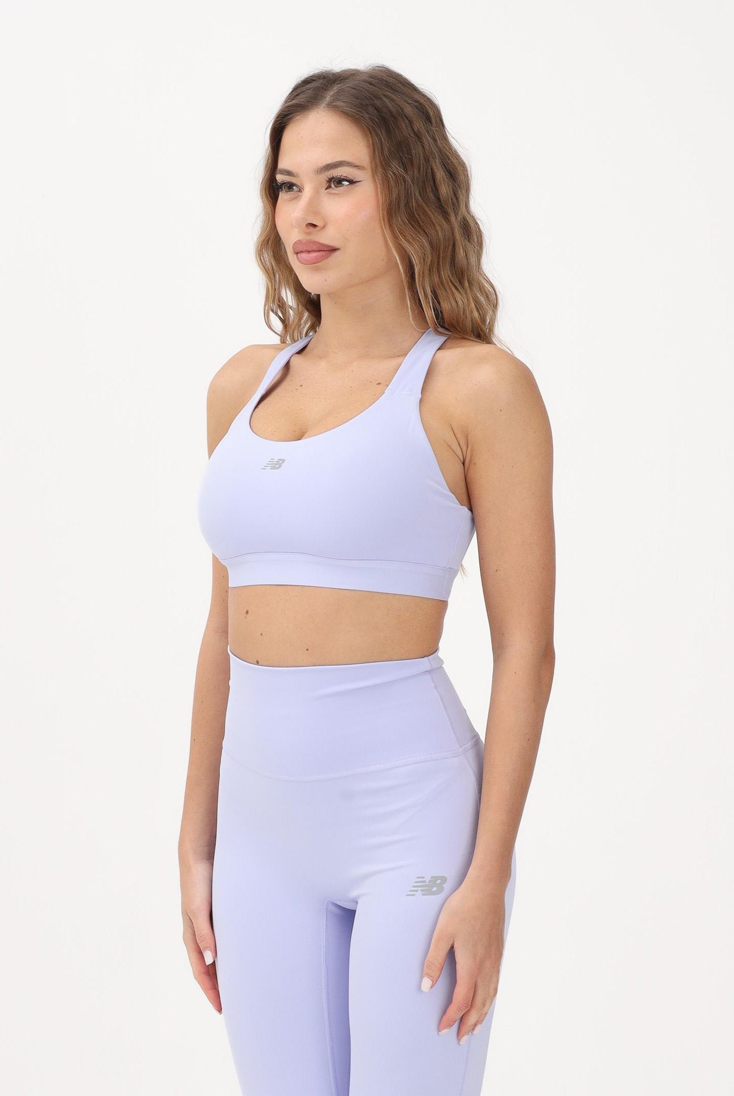 NEW BALANCE Bralette sportiva NB Essential lilla da donna WB51035DYK . NEW BALANCE