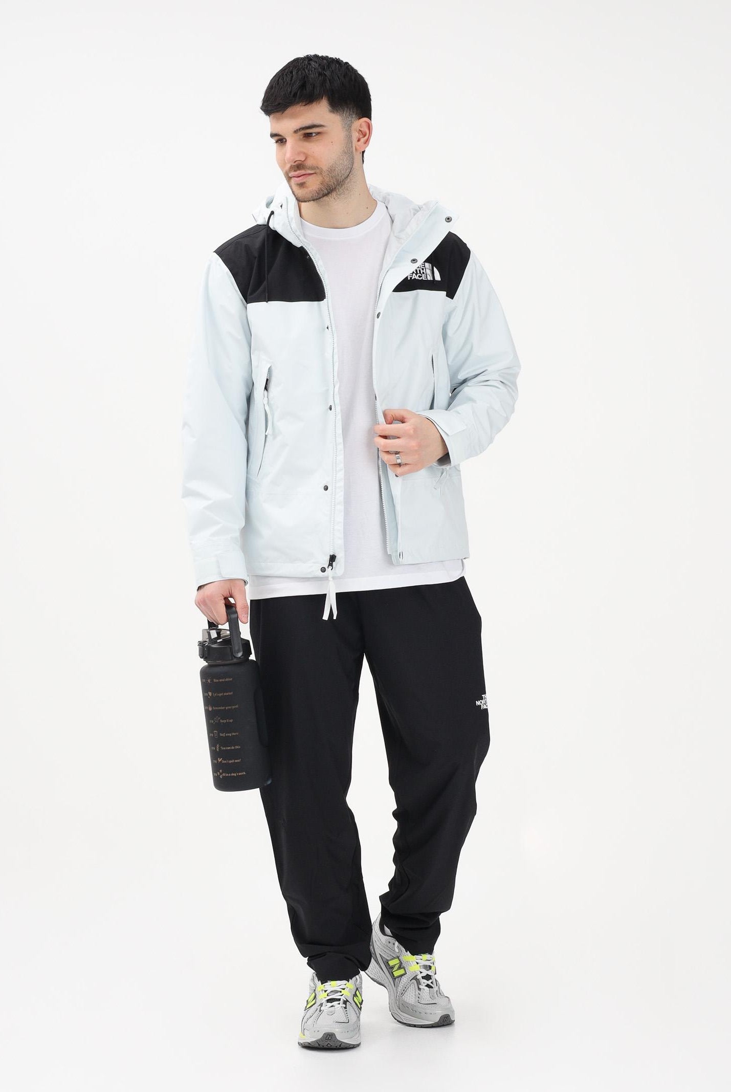 THE NORTH FACE Giacca a vento Reign On celeste e nera da uomo NF0A8B5GJL61 . THE NORTH FACE