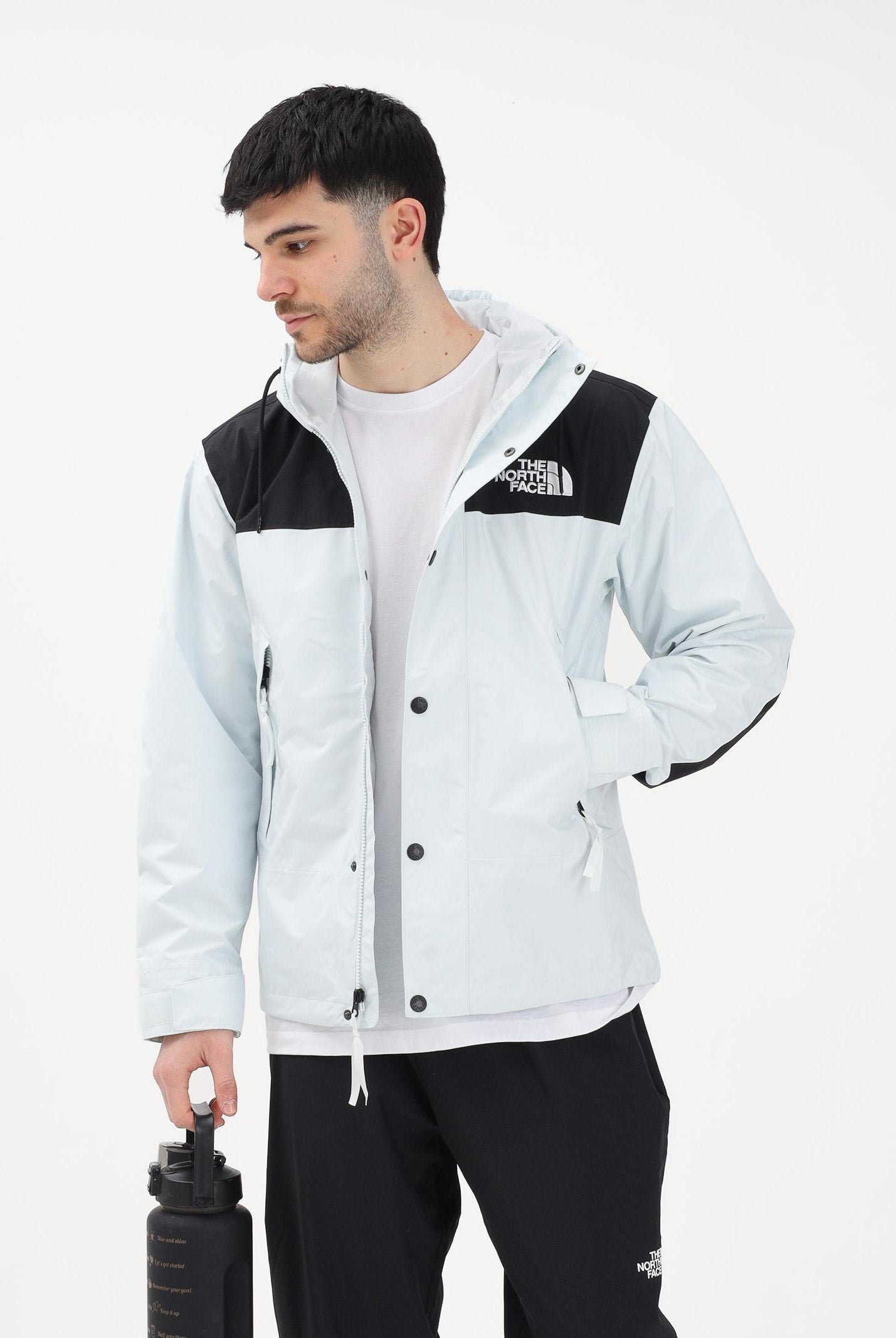 THE NORTH FACE Giacca a vento Reign On celeste e nera da uomo NF0A8B5GJL61 . THE NORTH FACE