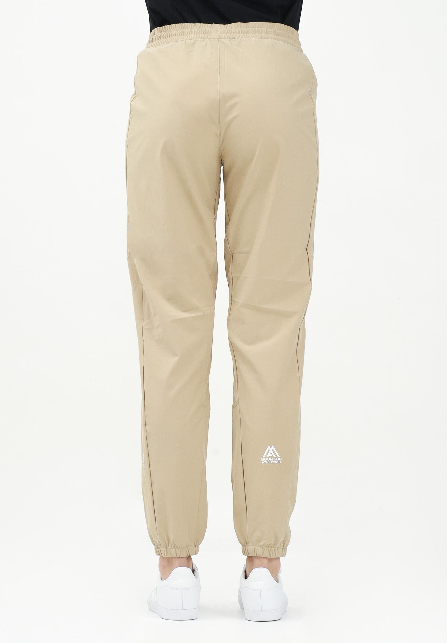THE NORTH FACE Pantalone antivento Mountain Athletics beige da donna NF0A8BGPLK51 . THE NORTH FACE