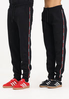 GCDS Pantalone sportivo nero per uomo e donna con banda logata B2EW3002JD1 99 GCDS 