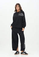 MAISON MARGIELA Pantalone sportivo nero per donna, ragazzi e bambini con spacchetti interni alla caviglia M60895MM02X M6900 MAISON MARGIELA 