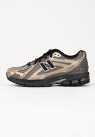 NEW BALANCE Sneakers 1906R nere, beige e oro da uomo U1906RCJ . NEW BALANCE 