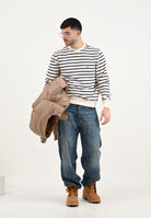 TOMMY JEANS Jeans in denim blu da uomo con ricamo sul retro DM0DM212031A5 . TOMMY JEANS 