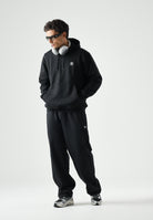 ADIDAS ORIGINALS Felpa con cappuccio Trefoil Essentials Loose nera da uomo JV6056 . ADIDAS ORIGINALS 