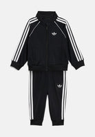 ADIDAS ORIGINALS Tuta SST nera da neonato con iconiche 3-stripes laterali KD1029 . ADIDAS ORIGINALS 
