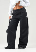 ADIDAS ORIGINALS Pantaloni neri da donna con gamba ampia e mini logo iconico laterale KR3606 . ADIDAS ORIGINALS 