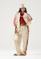 ADIDAS ORIGINALS Felpa con zip FIREBIRD TRACK TOP LOOSE Warm Vanilla per uomo e donna con iconiche 3-Stripes rosse KS4674 . ADIDAS ORIGINALS 