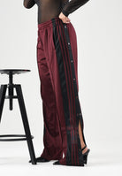 ADIDAS ORIGINALS Pantaloni FIREBIRD bordeaux da donna con bande laterali nere e vita elasticizzata KT0029 . ADIDAS ORIGINALS 