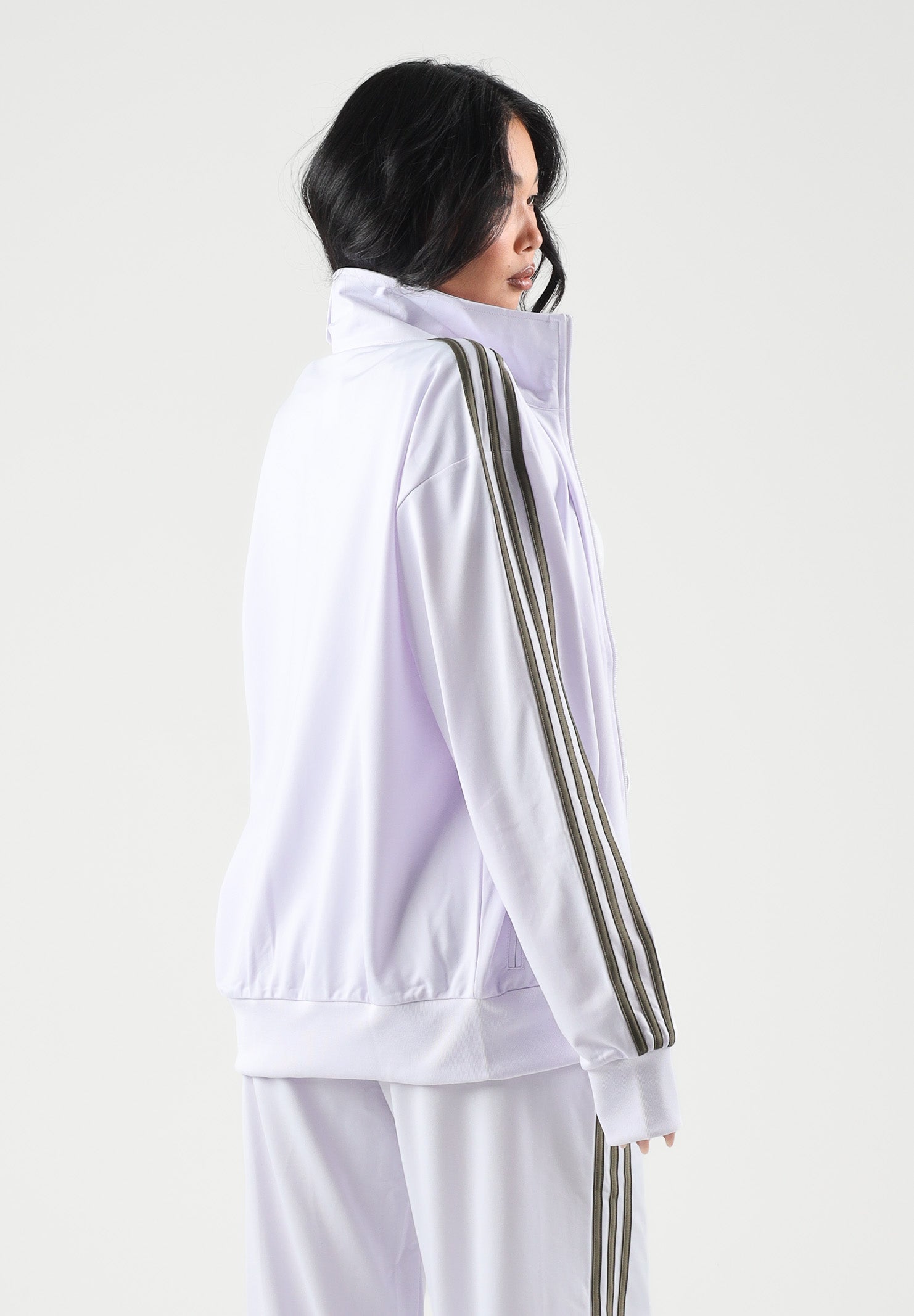 ADIDAS ORIGINALS Felpa con zip  FIREBIRD lilla da donna con 3-stripes iconiche e mini logo KU8195 . ADIDAS ORIGINALS 