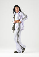 ADIDAS ORIGINALS Pantaloni FIREBIRD LOOSE lilla da donna con iconiche 3-stripes verdi KV2232 . ADIDAS ORIGINALS 