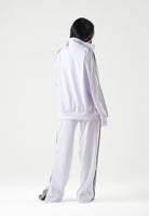 ADIDAS ORIGINALS Pantaloni FIREBIRD LOOSE lilla da donna con iconiche 3-stripes verdi KV2232 . ADIDAS ORIGINALS 