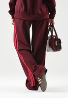 ADIDAS ORIGINALS Pantaloni FIREBIRD LOOSE maroon bordeaux da donna KW0230 . ADIDAS ORIGINALS 