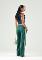 ADIDAS ORIGINALS Pantaloni FIREBIRD, warm-vaniglia, verde da donna con 3-stripes iconiche <BR/><BR/> KY0884 . ADIDAS ORIGINALS 