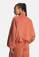 ADIDAS ORIGINALS Felpa con zip ADILENIUM SEASON 6 FAUX SUEDE TRACK TOP Vermillion arancione vermiglio da donna in tessuto spacer effetto scamosciato sintetico, con collo alto, zip frontale integrale, maniche lunghe con tre strisce bianche a contrasto LH1922 . ADIDAS ORIGINALS 