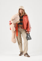 ADIDAS ORIGINALS Felpa con zip ADILENIUM SEASON 6 FAUX SUEDE TRACK TOP Vermillion arancione vermiglio da donna in tessuto spacer effetto scamosciato sintetico, con collo alto, zip frontale integrale, maniche lunghe con tre strisce bianche a contrasto LH1922 . ADIDAS ORIGINALS 