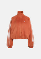 ADIDAS ORIGINALS Felpa con zip ADILENIUM SEASON 6 FAUX SUEDE TRACK TOP Vermillion arancione vermiglio da donna in tessuto spacer effetto scamosciato sintetico, con collo alto, zip frontale integrale, maniche lunghe con tre strisce bianche a contrasto LH1922 . ADIDAS ORIGINALS 