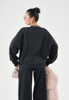 ADIDAS PERFORMANCE Felpa ESSENTIALS SMALL LOGO FEELCOZY Black / White nera da donna in misto cotone e poliestere riciclato con interno felpato garzato, girocollo classico, maniche lunghe, linea ampia e rilassata, polsini e fondo a costine e piccolo l JC5932 . ADIDAS PERFORMANCE 