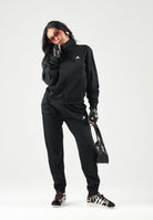ADIDAS PERFORMANCE Tuta sportiva Essentials Feel Cozy nera da donna con finitura lucida acetata JD4475 . ADIDAS PERFORMANCE 
