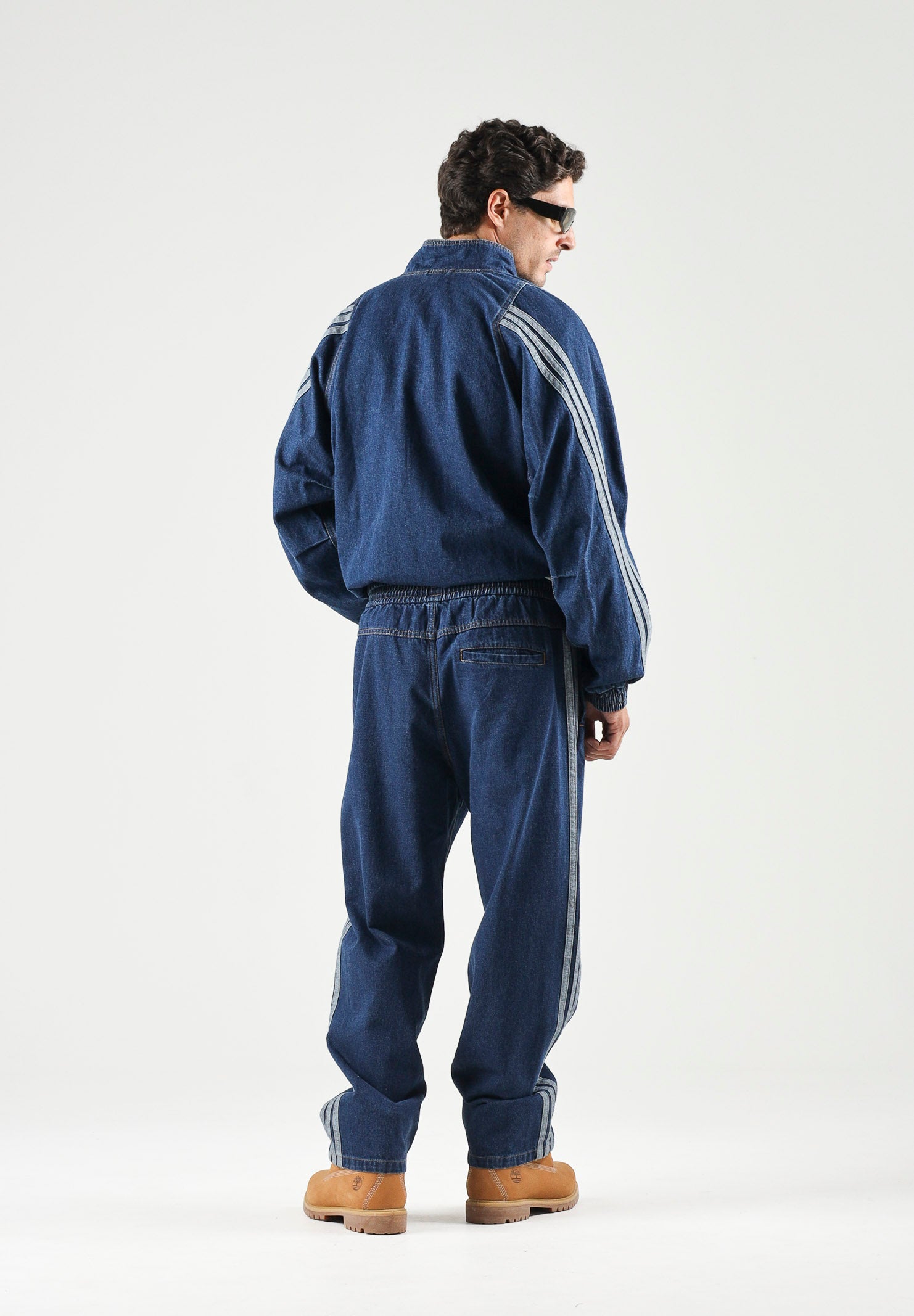 ADIDAS PERFORMANCE Jeans indigo blu da uomo con iconiche 3-Stripes laterali a contrasto. KV8348 . ADIDAS PERFORMANCE 