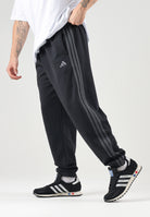 ADIDAS PERFORMANCE pantaloni sportivi Essentials 3-Stripes Fleece Tapered Cuffed Pants Black/Carbon nero da uomo. KY4124 . ADIDAS PERFORMANCE 