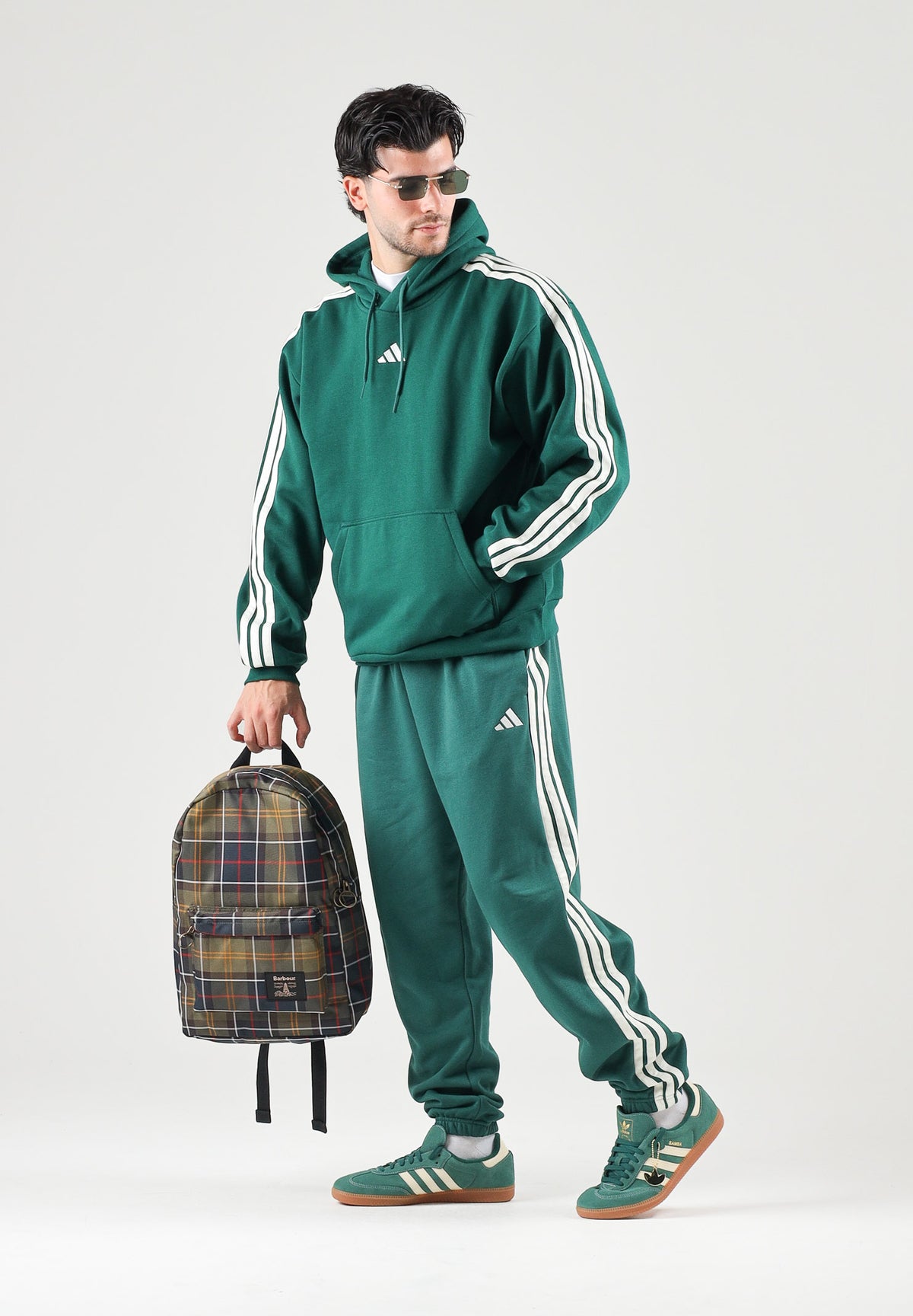 ADIDAS PERFORMANCE Pantaloni ESSENTIALS 3 verdi per uomo con tre strisce laterali e fondo elasticizzato KY4129 . ADIDAS PERFORMANCE 
