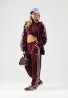 ADIDAS PERFORMANCE  Pantaloni sportivi ESSENTIALS 3-STRIPES bordeaux per uomo e donna<BR/> KY4134 . ADIDAS PERFORMANCE 