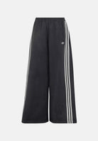 ADIDAS ORIGINALS Pantaloni ADILENIUM SEASON 6 FAUX SUEDE TRACK PANT Black neri da donna, effetto camoscio, bande laterali e tasche con zip.<BR/> LH1928 . ADIDAS PERFORMANCE 