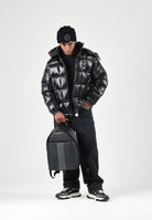 ARMANI EXCHANGE Piumino nero da uomo con cappuccio imbottito e trapuntatura a blocchi. XM003344AF23755 UC001 ARMANI EXCHANGE 