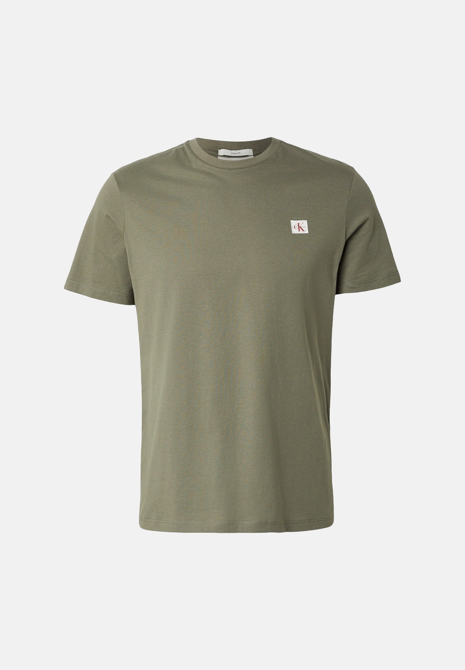 CALVIN KLEIN JEANS T-shirt COTTON BADGE, dusty-olive verde da uomo con piccolo stemma logo sul petto. <BR/> LV04RC272G LDY CALVIN KLEIN JEANS 