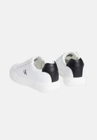 CALVIN KLEIN JEANS Sneakers in pelle bianche e nere da uomo con dettagli neri a contrasto e monogramma CK laterale.<BR/> YM0YM01344 06X CALVIN KLEIN JEANS 