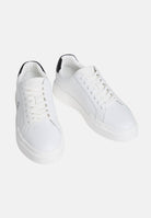 CALVIN KLEIN JEANS Sneakers in pelle bianche e nere da uomo con dettagli neri a contrasto e monogramma CK laterale.<BR/> YM0YM01344 06X CALVIN KLEIN JEANS 