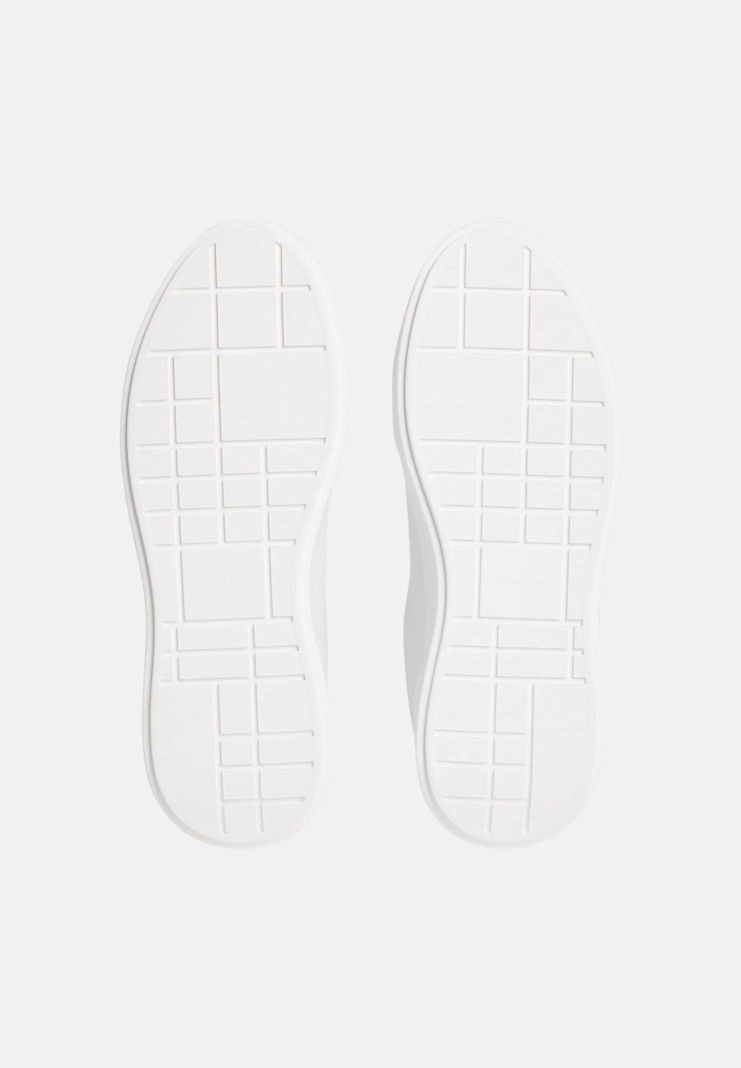 CALVIN KLEIN JEANS Sneakers in pelle bianche e nere da uomo con dettagli neri a contrasto e monogramma CK laterale.<BR/> YM0YM01344 06X CALVIN KLEIN JEANS 