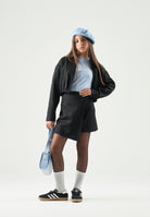 DIESEL Gonna GREBY colore  nero per donna, ragazzi e  bambini con design plissettato e taglio asimmetrico.<BR/> J02902KXBSJ K900 DIESEL 
